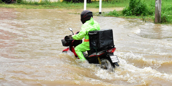 Delivery motorcycle in rain
